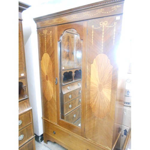 118 - An Edwardian mahogany and satinwood inlaid wardrobe with harebell decoration, fitted centre mirrored... 