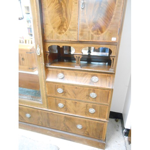 119 - An Edwardian mahogany and inlaid Beaconsfield style wardrobe fitted mirrored door flanked by two pan... 