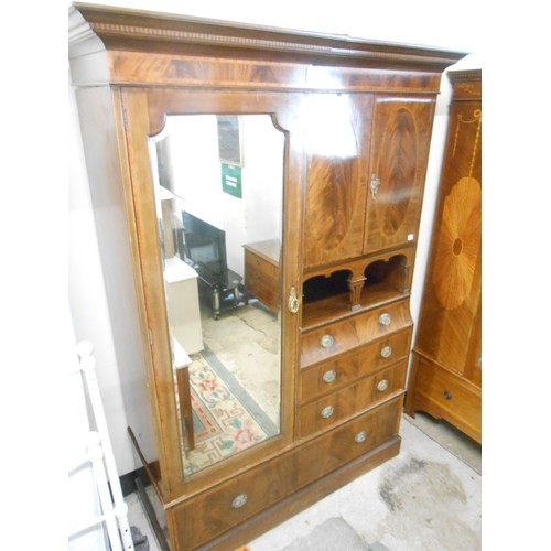 119 - An Edwardian mahogany and inlaid Beaconsfield style wardrobe fitted mirrored door flanked by two pan... 