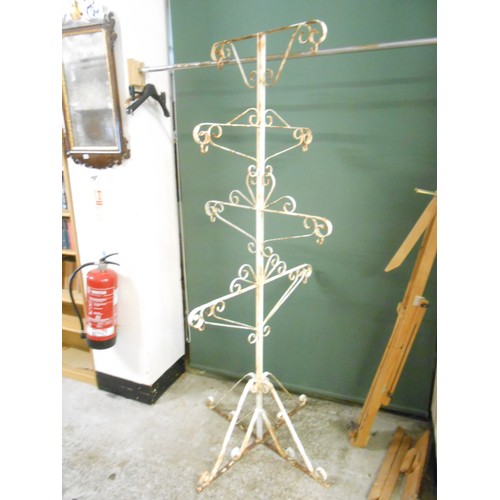 147 - A cream painted wrought iron five tier garden planter with scrolling arms and legs