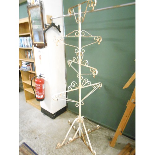 147 - A cream painted wrought iron five tier garden planter with scrolling arms and legs