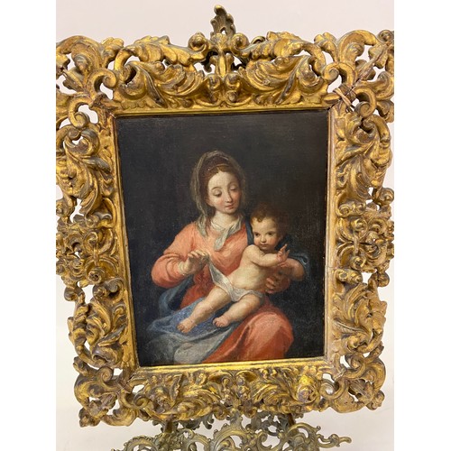 20 - Oils on canvas - Madonna and child, in a Florentine style gilt wood frame - 11in. x 8 1/2in.