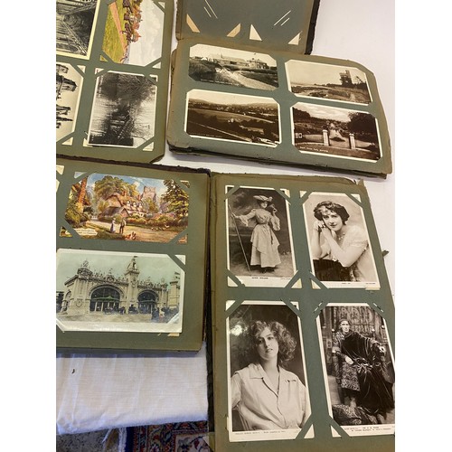 40 - A partial scrap album of coloured and black and white postcards