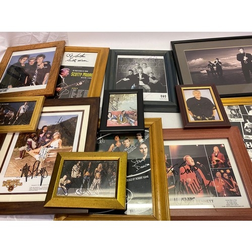 43 - A collection of photographs bearing signatures including Black Eyed Peas, Chris Farlowe, Chesney Haw... 