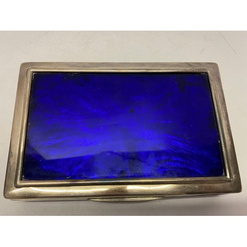 184 - A silver cigarette box with inset blue foil panel to the lid - London 1901 - 6 3/4in. x 4 1/2in. x 1... 