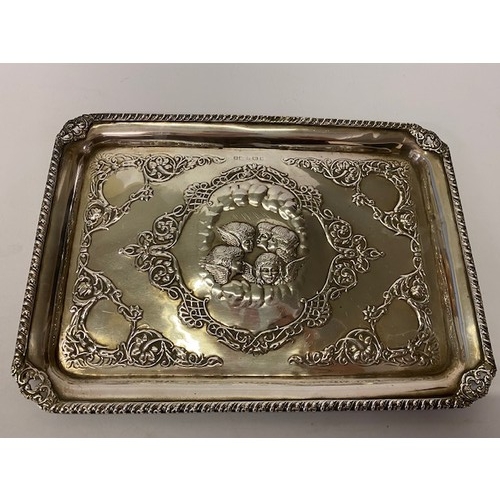 187 - A rectangular silver dressing table tray with pierced and gadroon border, the centre with four angel... 