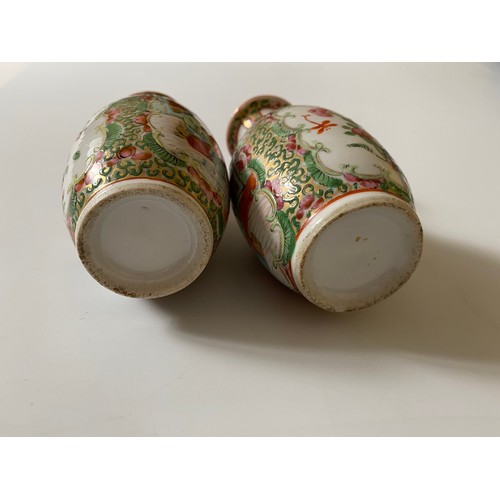 101 - A pair of small Cantonese baluster form vases decorated figures and flowers in reserves - 5in. high