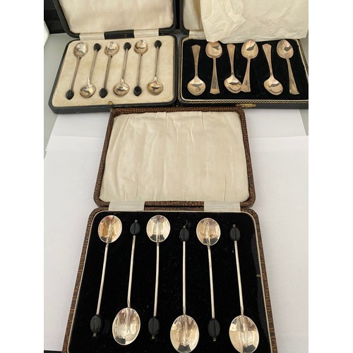 184 - A set of six Walker and Hall silver coffee spoons with bean terminals, cased, one other set of six s... 