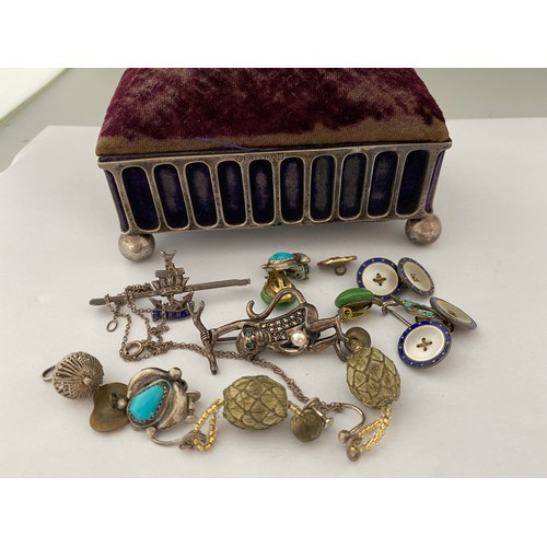 202 - A silver plated jewellery casket with pin cushion top containing a small silver and turquoise set wi... 