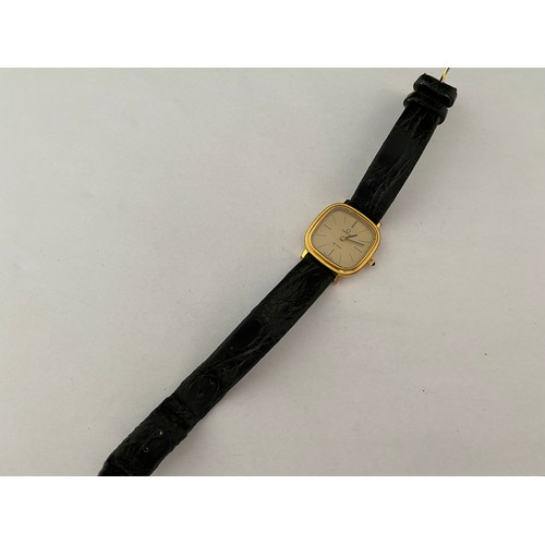 204 - A lady's Omega Deville quartz wristwatch in a gold plated case, on black leather strap