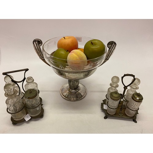 190 - A WMF fruit bowl with glass liner - 10in. high and two four bottle cruets on silver plated stands