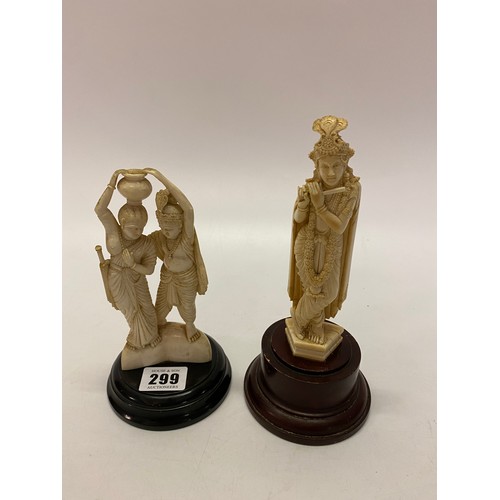 299 - Two Indian carved ivory figures of gods, on wooden stands - 7in. and 8in. high