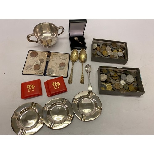 186 - A silver double handled cup, two silver gilt berry spoons, a silver cruet spoon, silver plated ashtr... 