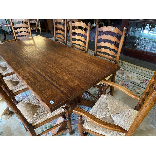 80 - An oak refectory style dining table with rectangular top, on 'X' shaped end standards - 78in. x 36in... 