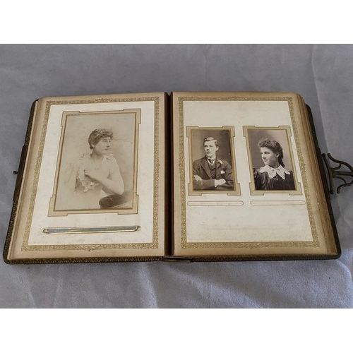 11 - A Victorian brown leather photograph album and contents and a writing album containing sketches, ver... 