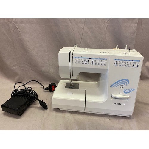 20 - A Silver Crest electric sewing machine in box