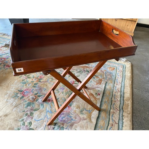 68 - A mahogany butler's tray on folding stand - 30 1/2in. wide