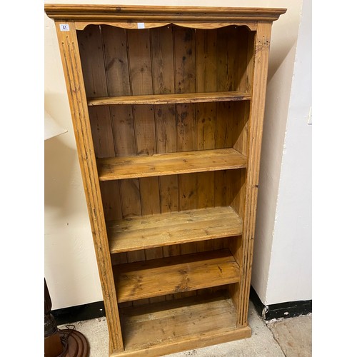 41 - A pine openfront bookcase fitted four adjustable shelves - 34in. wide