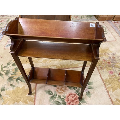 23 - An Edwardian mahogany and satinwood inlaid book trough with inlaid pateraes to the ends, the base fi... 