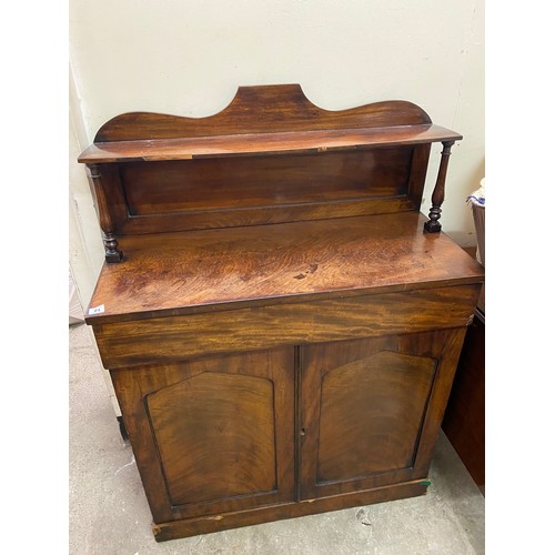 21 - A 19th Century mahogany chiffonier, the raised back fitted shelf with turned supports, the base with... 