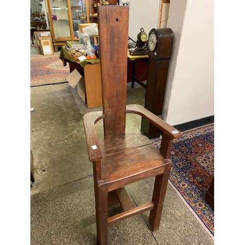 35 - A wooden chair with high back and seat, on square legs