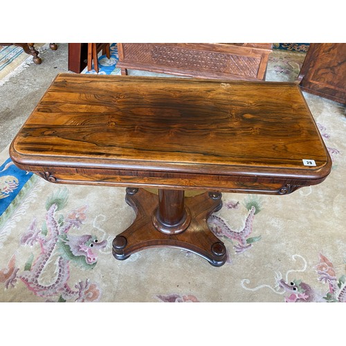 29 - A 19th Century rosewood card table with rectangular folding top, on gun barrel column, quatrefoil ba... 