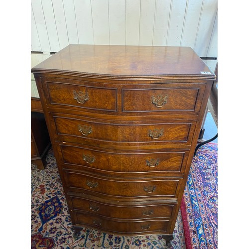 48 - A walnut veneered chest with serpentine front, fitted two narrow and five wide drawers, on cabriole ... 