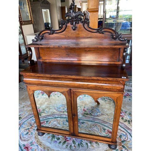 55 - A 19th Century rosewood chiffonier, the raised back with leaf scroll pediment, fitted shelf, 'S' scr... 