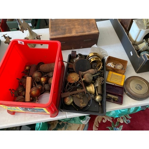 70 - A collection of brass longcase clock finials and clock weights