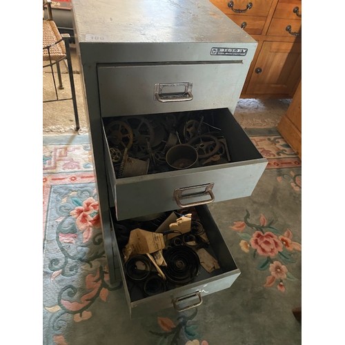 100 - A grey metal filing chest containing carriage clock balances, clock wheels, springs, orb finials, wa... 