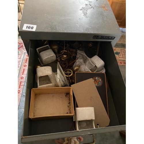 100 - A grey metal filing chest containing carriage clock balances, clock wheels, springs, orb finials, wa... 