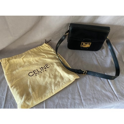 140 - A Celine vintage black calf leather box bag with gilt horse and carriage buckle, the interior with t... 