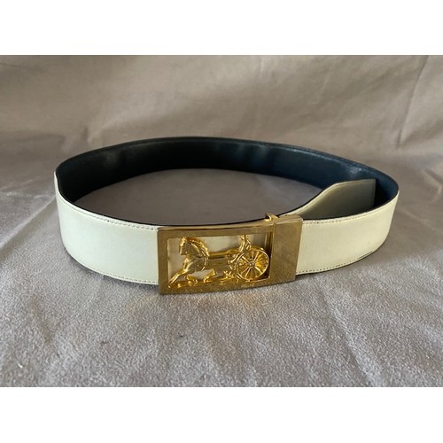 144 - A vintage Celine navy calf leather reversible belt with gilt metal horse and carriage buckle, stampe... 