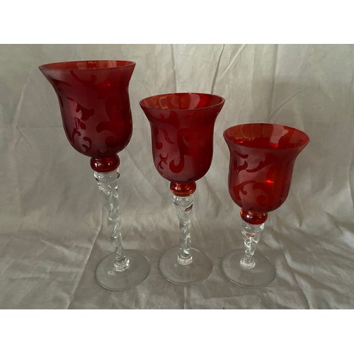 150 - Three graduated goblets with acid etched red bowls, on twist stems