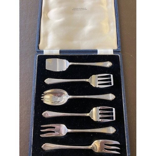 257 - A case containing a silver preserve spoon, two cake forks, two sardine forks and runcible  spoon - S... 