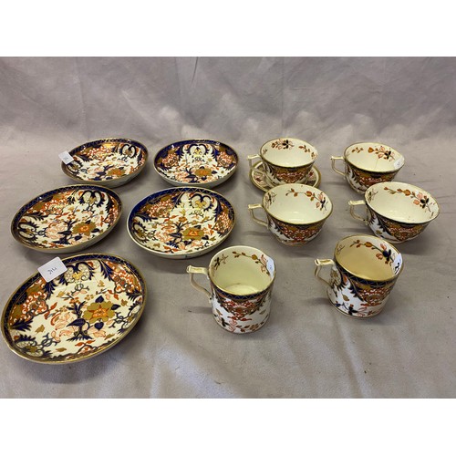 214 - Four 19th Century Derby Imari pattern tea cups and saucers, two similar coffee cans and two similar ... 