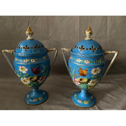 122 - A pair of 19th Century Continental porcelain pot pourri vases, blue ground painted birds, nests, but... 