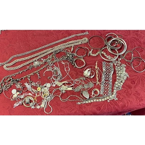 213 - A selection of silver and silver coloured metal earrings, bangles, necklaces etc..