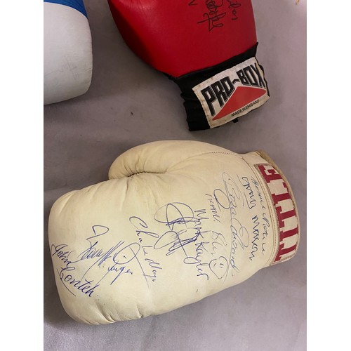 261 - Three signed boxing gloves including signatures of Henry Cooper, John Conteh