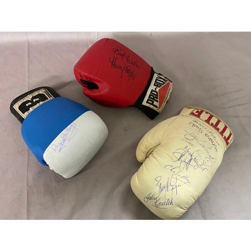 261 - Three signed boxing gloves including signatures of Henry Cooper, John Conteh