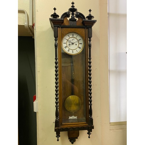 31 - A Vienna regulator wall clock with white enamel dial, twin weight movement, in a mahogany case