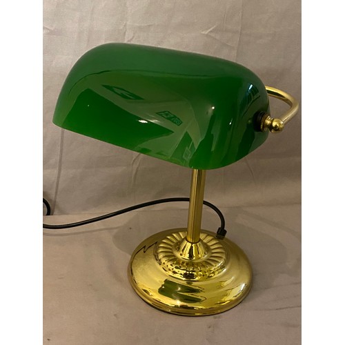 30 - A desk lamp with green glass shade, on brass lacquered base