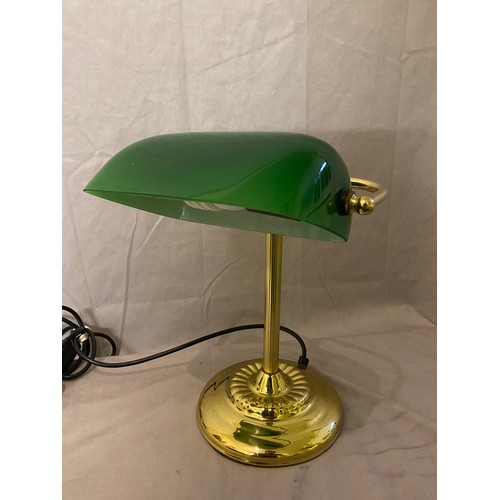 30 - A desk lamp with green glass shade, on brass lacquered base