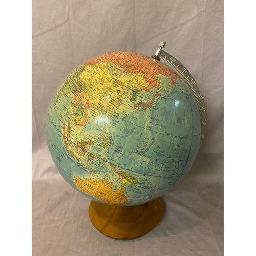 253 - A GDR globe on oak stand and a part model of a pond yacht