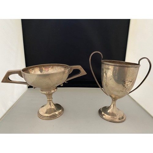 200 - A silver urn shaped double handled trophy cup, on circular foot - Chester 1906, makers marks for Pea... 