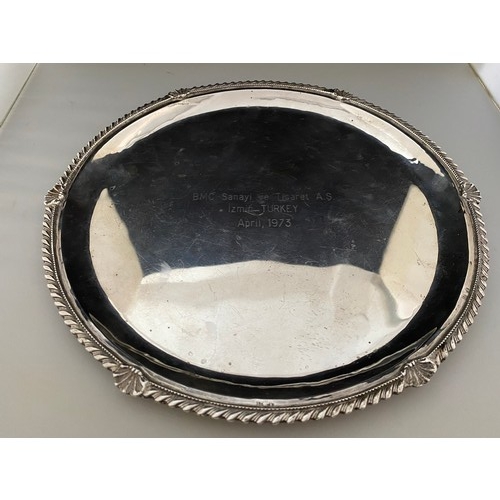 209 - A circular Continental silver coloured metal salver with gadroon and shell pattern border - 10 1/2in... 