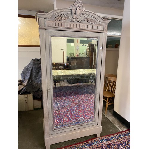 105 - A grey painted French armoire with carved pediment, mirrored door, on square legs - 38 1/2in. wide