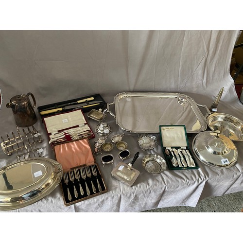 210 - A selection of silver plated items including toast racks, entree dishes, sugar castor, crumb trays, ... 