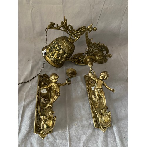 264 - A pair of gilt wall lights decorated with cupids holding candlearms - 12in. high and a large brass w... 