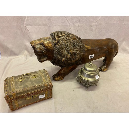 263 - A large carved wood Eastern lion, a velvet covered casket, a silver plated sugar basin etc..